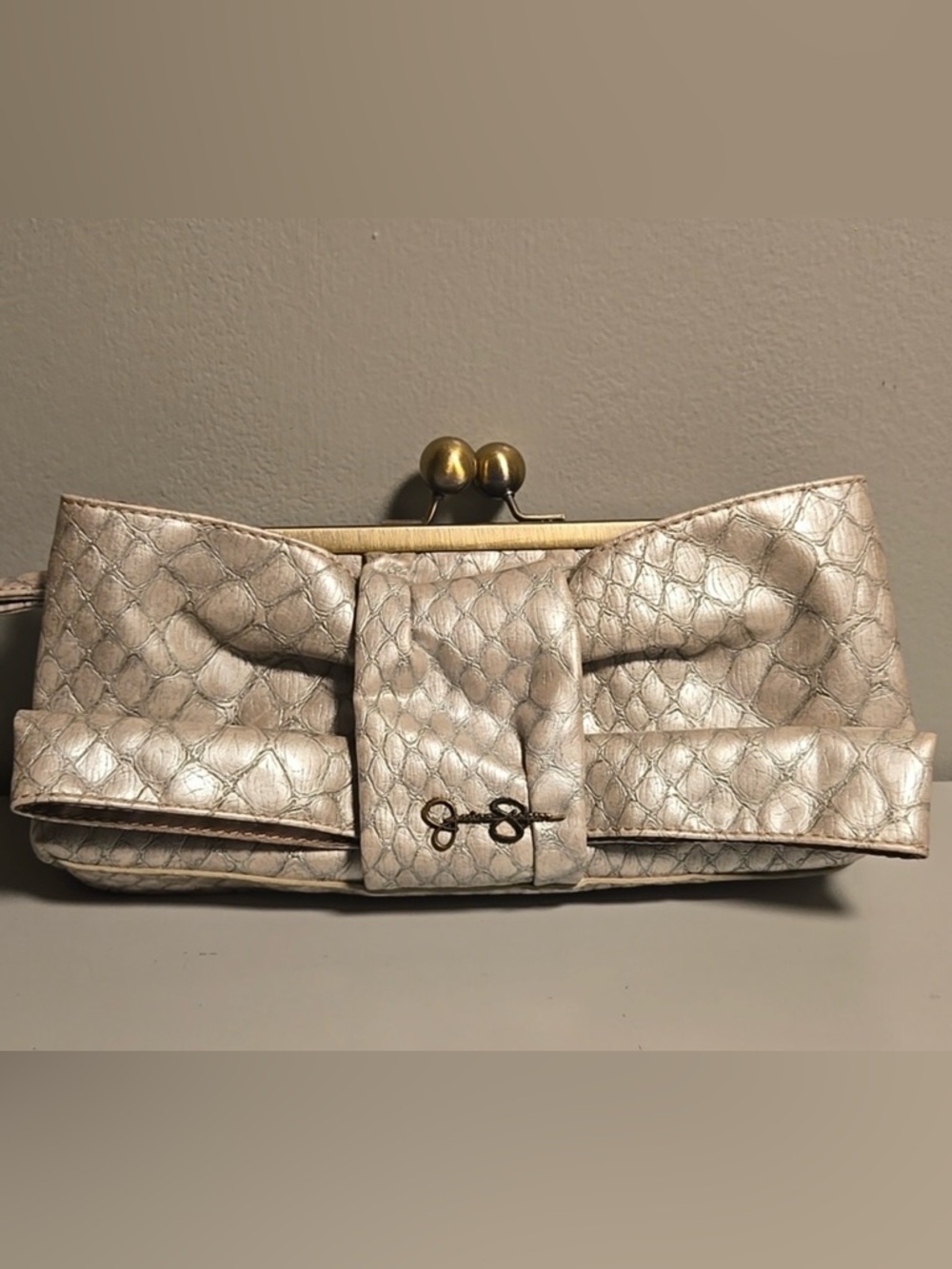 Jessica Simpson Silver Kisslock, a metallic frame.
